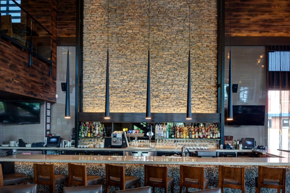 Bloom Lighting Group CP Collection pendant lights over a bar