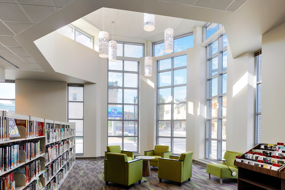 Lumetta Lite cylindrical pendant lighting in a library
